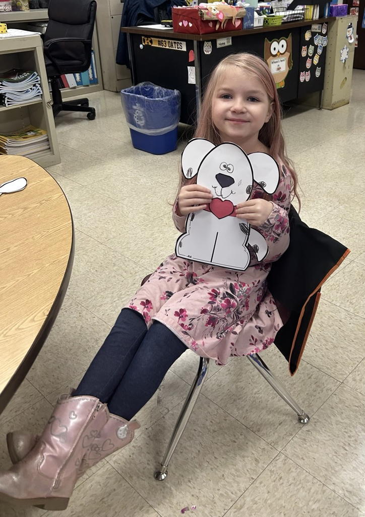 Photo of student and Dalmatian craft.