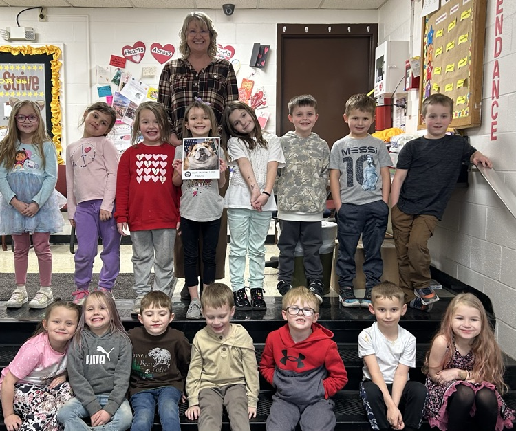 Students pictured with a Valentine from Baby Dog.
