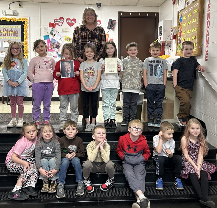 Students pictured with a Valentine from President Trump.