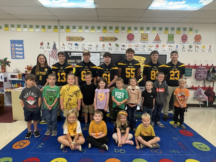 A photo of the kindergarten class with the KHS student athletes. 
