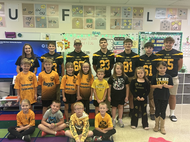 A photo of the 1st grade  with the KHS student athletes. 