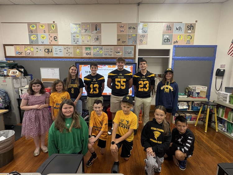 A photo of 4th grade  with the KHS student athletes. 