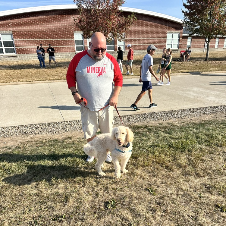 Principal Mangun and his furry friend Bernie are bringing the Minerva Running Lions some good luck at Cross Country today! 🦁🏃♂️🐾 Go Lions! #MinervaPride