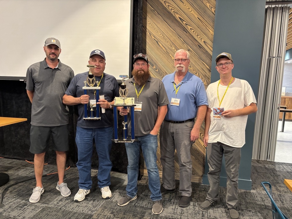 Five members o the transportation department standing together as two Mingo County Bus Operators receive awards at the recent WV Bus Rodeo competition