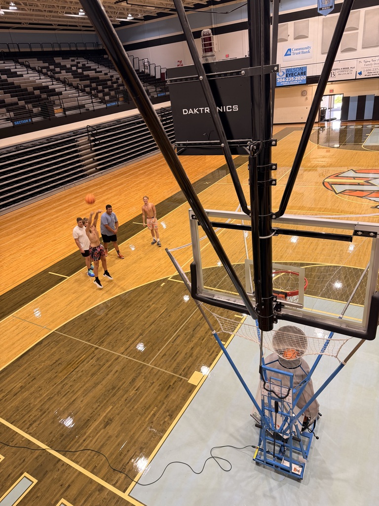 📸 Picture Description (Accessibility): Mingo Central basketball players are gathered inside the gym while the basketball court floor is being refinished. The team is working together during a flex day, showing their commitment and preparation for the upcoming basketball season despite the temporary changes in their practice environment. Coach Rob is with the team as they continue building chemistry and getting ready for another year of Miner basketball.