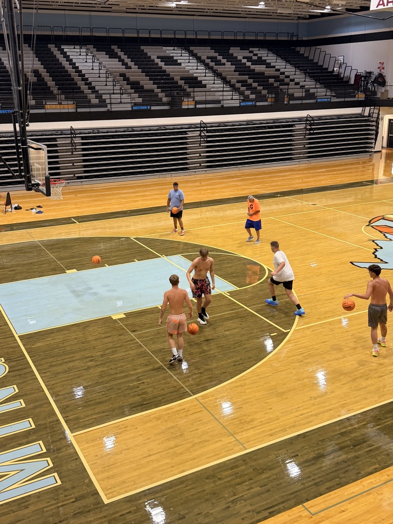 📸 Picture Description (Accessibility): Mingo Central basketball players are gathered inside the gym while the basketball court floor is being refinished. The team is working together during a flex day, showing their commitment and preparation for the upcoming basketball season despite the temporary changes in their practice environment. Coach Rob is with the team as they continue building chemistry and getting ready for another year of Miner basketball.