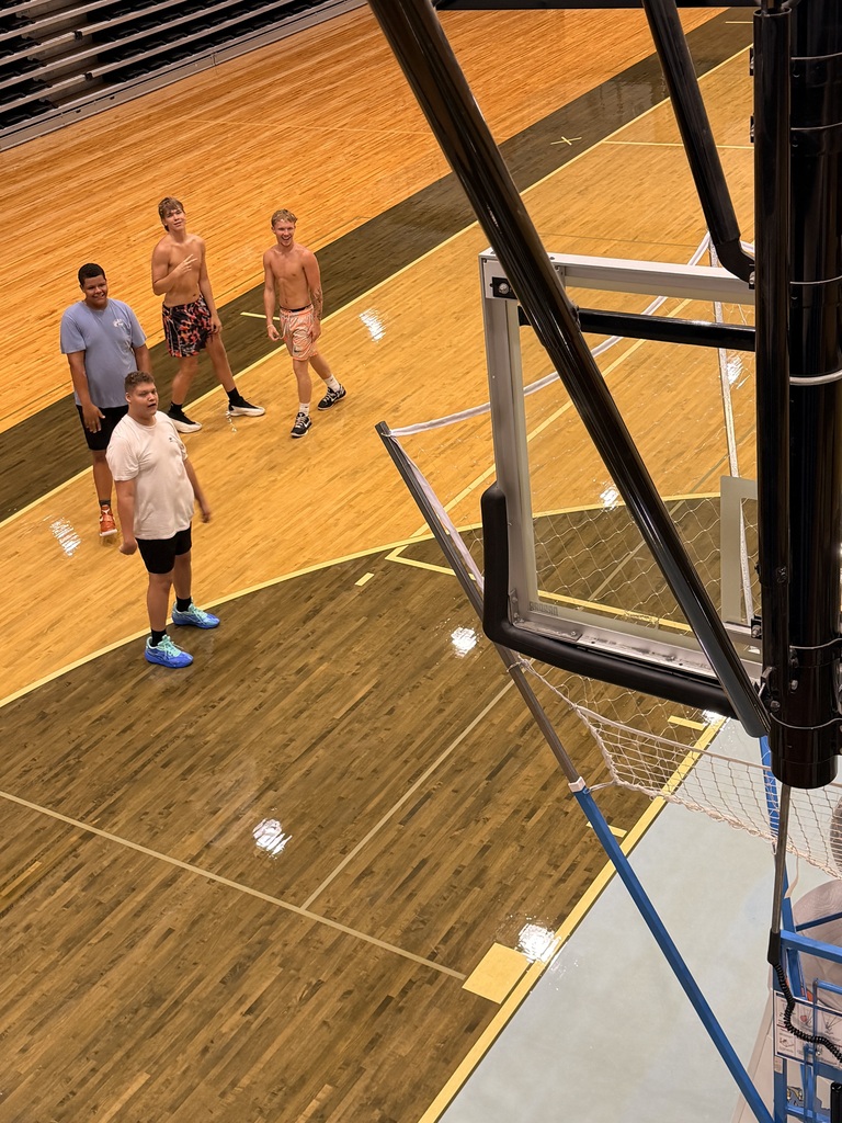 📸 Picture Description (Accessibility): Mingo Central basketball players are gathered inside the gym while the basketball court floor is being refinished. The team is working together during a flex day, showing their commitment and preparation for the upcoming basketball season despite the temporary changes in their practice environment. Coach Rob is with the team as they continue building chemistry and getting ready for another year of Miner basketball.