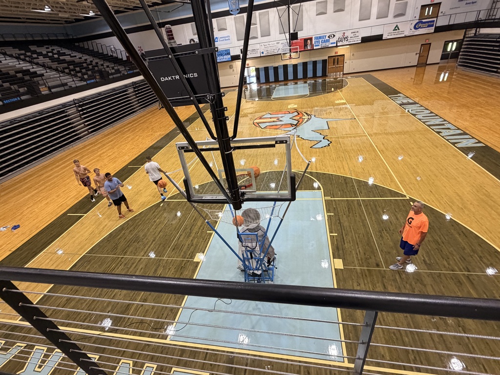 📸 Picture Description (Accessibility): Mingo Central basketball players are gathered inside the gym while the basketball court floor is being refinished. The team is working together during a flex day, showing their commitment and preparation for the upcoming basketball season despite the temporary changes in their practice environment. Coach Rob is with the team as they continue building chemistry and getting ready for another year of Miner basketball.