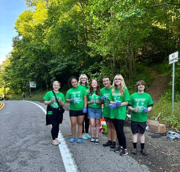 📸 Picture Description (Accessibility): Photos show Mingo Central Beta Club members volunteering at a water stop during the Hatfield McCoy Marathon and Mingo Central Cheerleaders participating in Champ Camp activities. The images highlight students serving their community, working together, and celebrating their achievements through teamwork, dedication, and school pride.