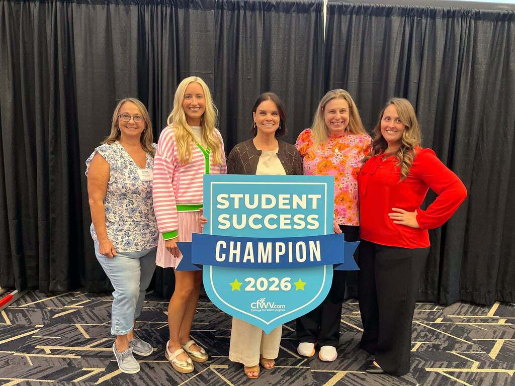 Mingo Central counselors Andrea Gilman and Chris Harmon are pictured at the 2026 Student Success Summit in Charleston, West Virginia, where Mingo Central High School was recognized as a CFWV Champion of College Access. The photo highlights their commitment to helping students prepare for college, careers, and future success.