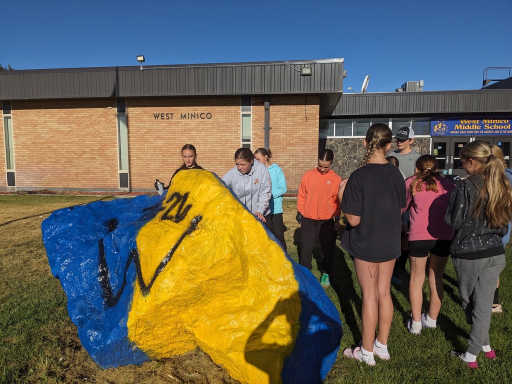 Students Painting the rock