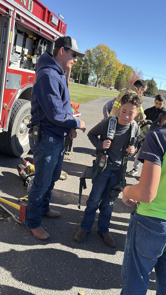 Student with firefighter backpack on