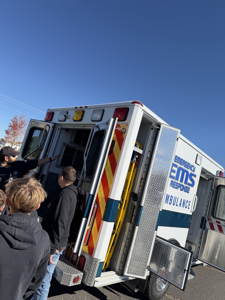 Students looking at ambulance