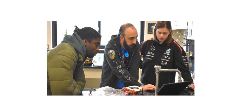 students and teacher in science class