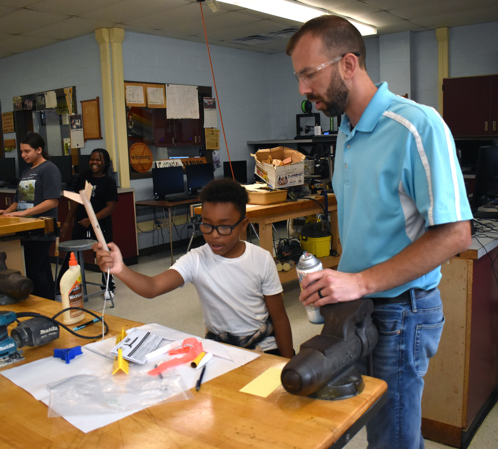 student with teacher