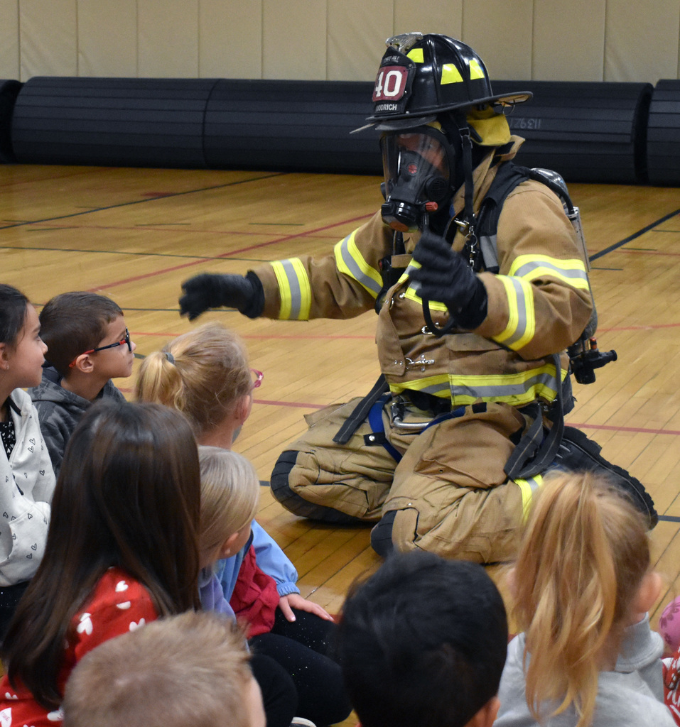 firefighters with students