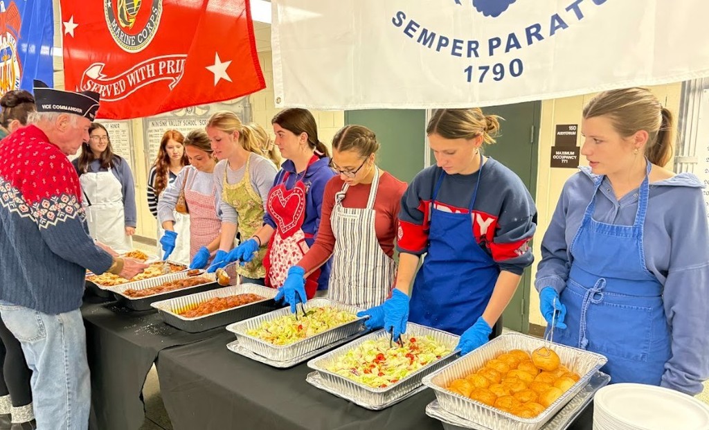 students serving food