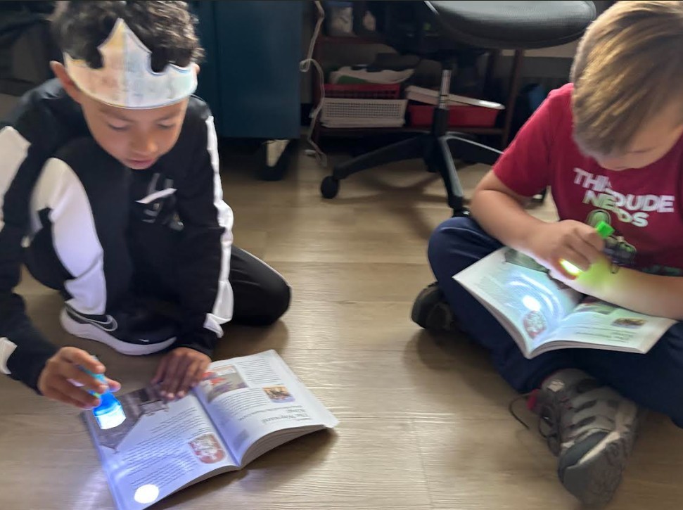 students with flashlights