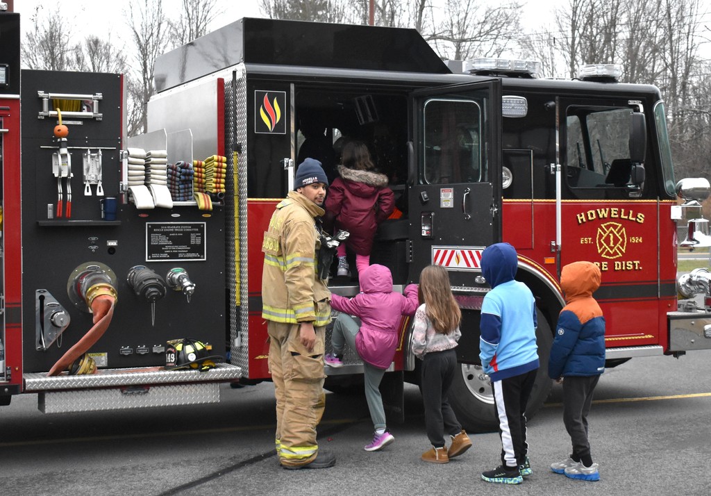 students with firetrucks