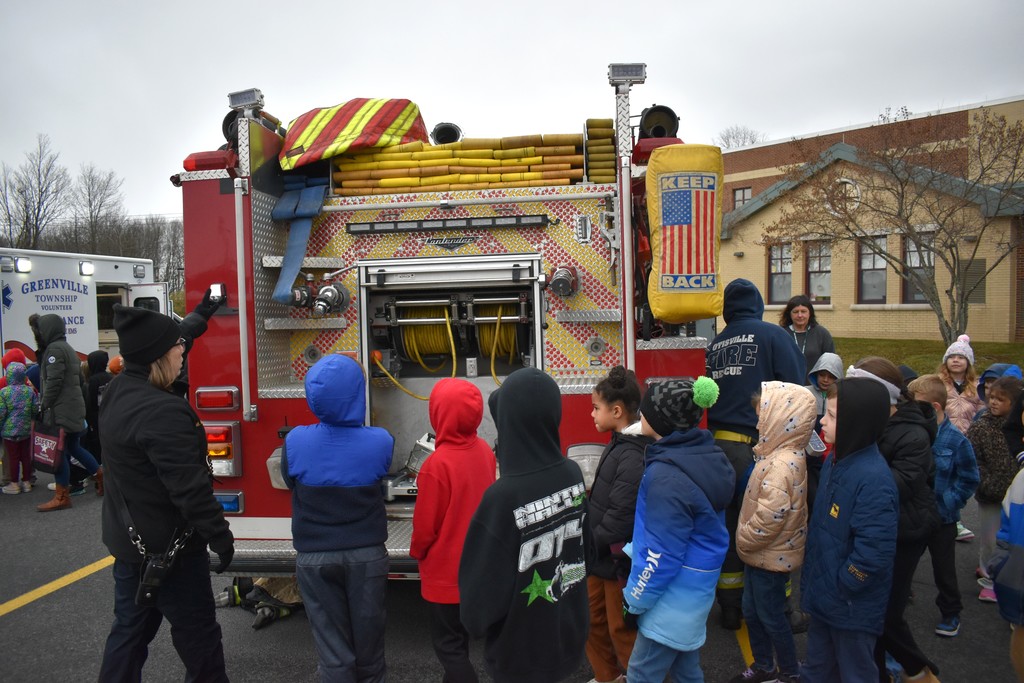 students with firetrucks