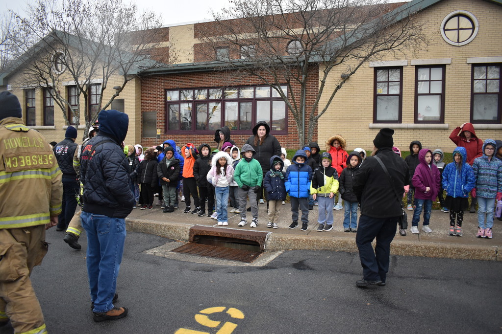 students with firefighters