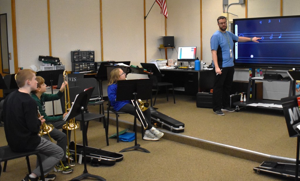 student in music class