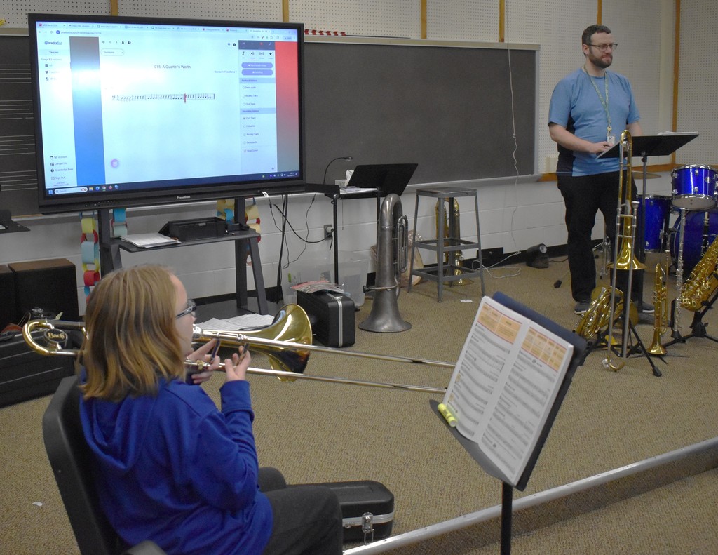 student in music class