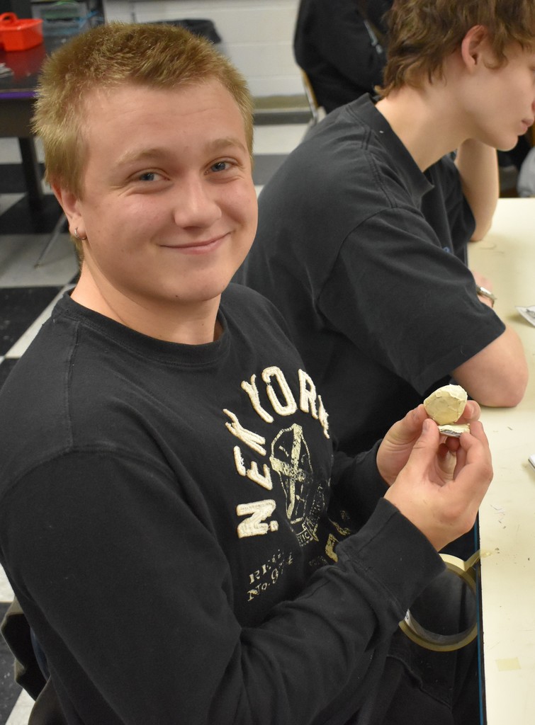 student in art class