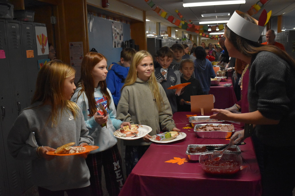 students being served food