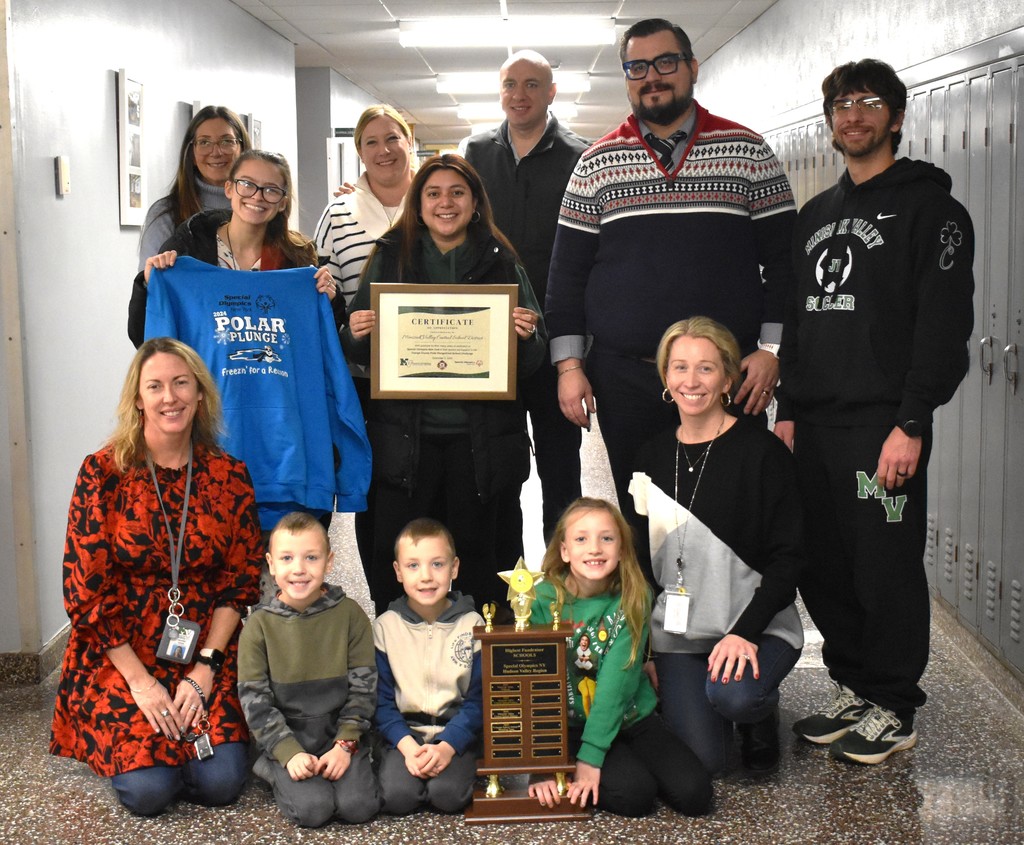 students and staff with trophy 