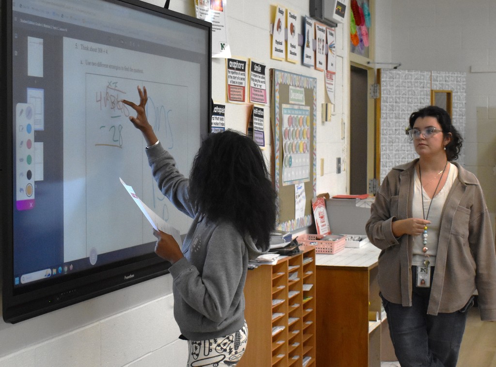 student and teacher in class