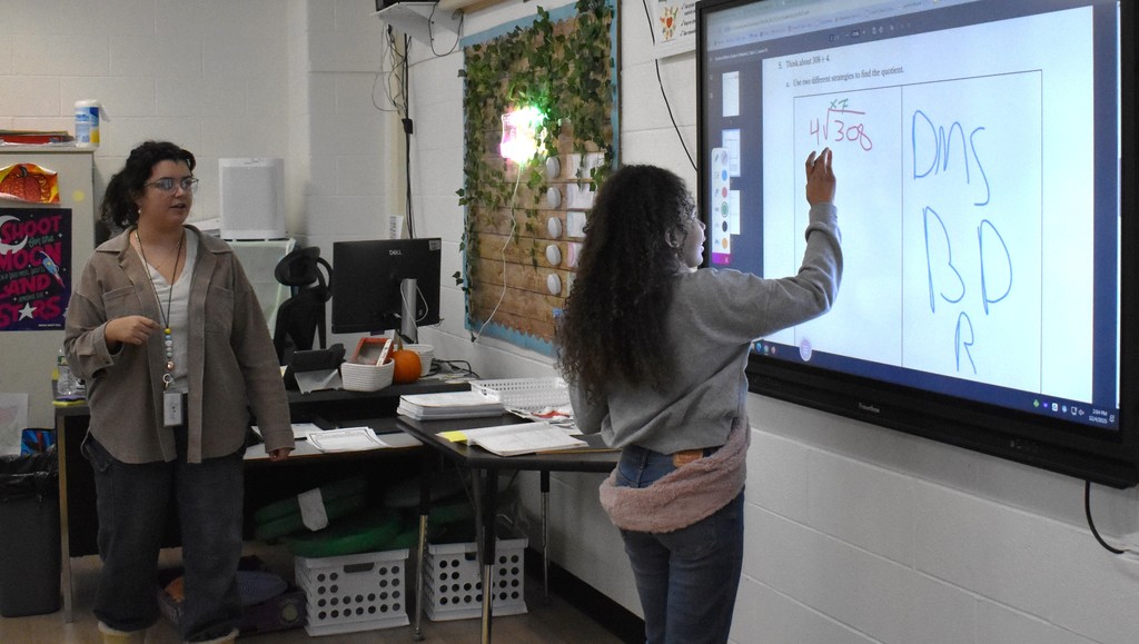 student and teacher in class