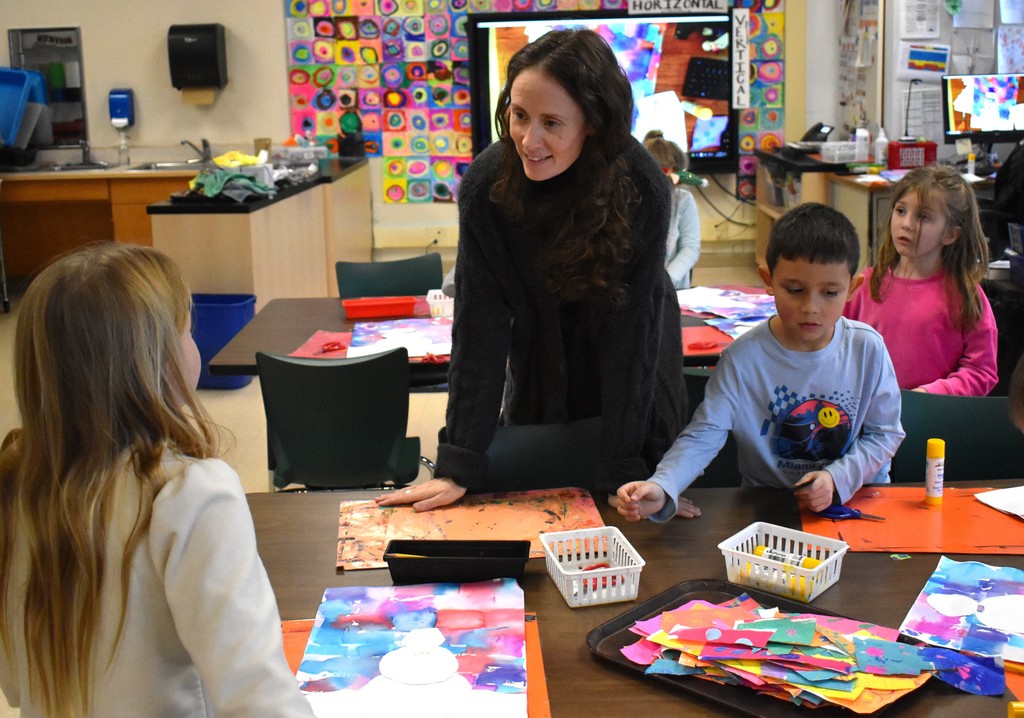 teacher and student in art class