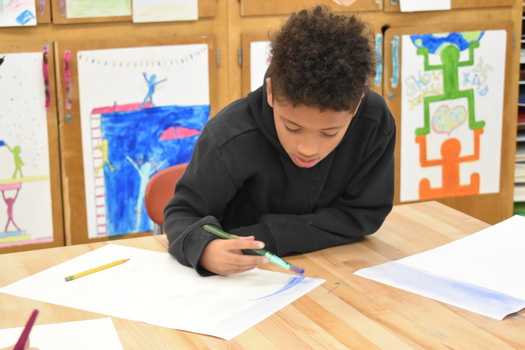 student in art class