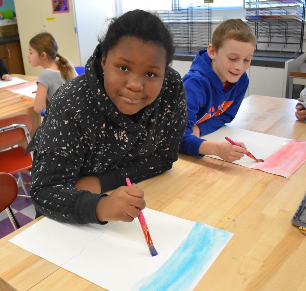 student in art class