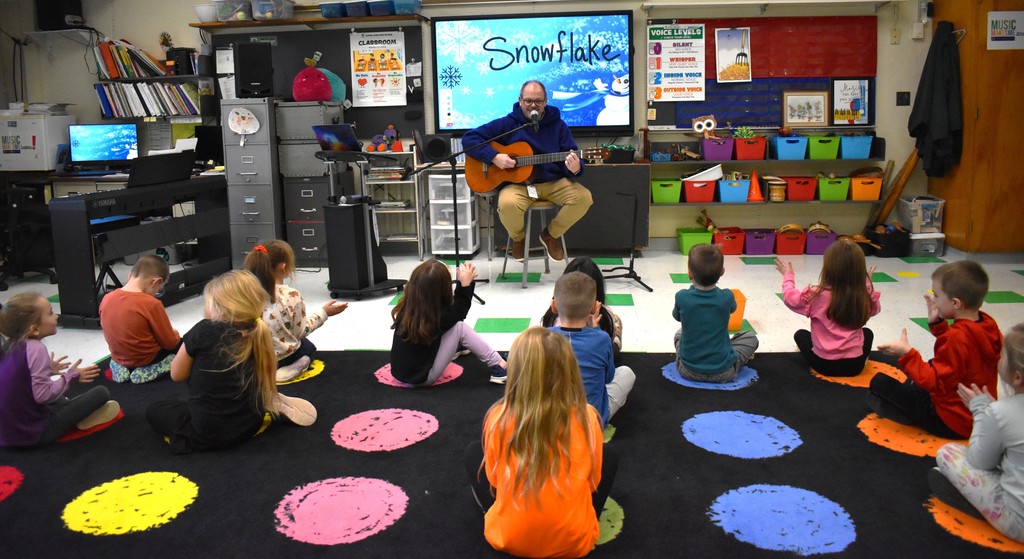 teacher and students in music class