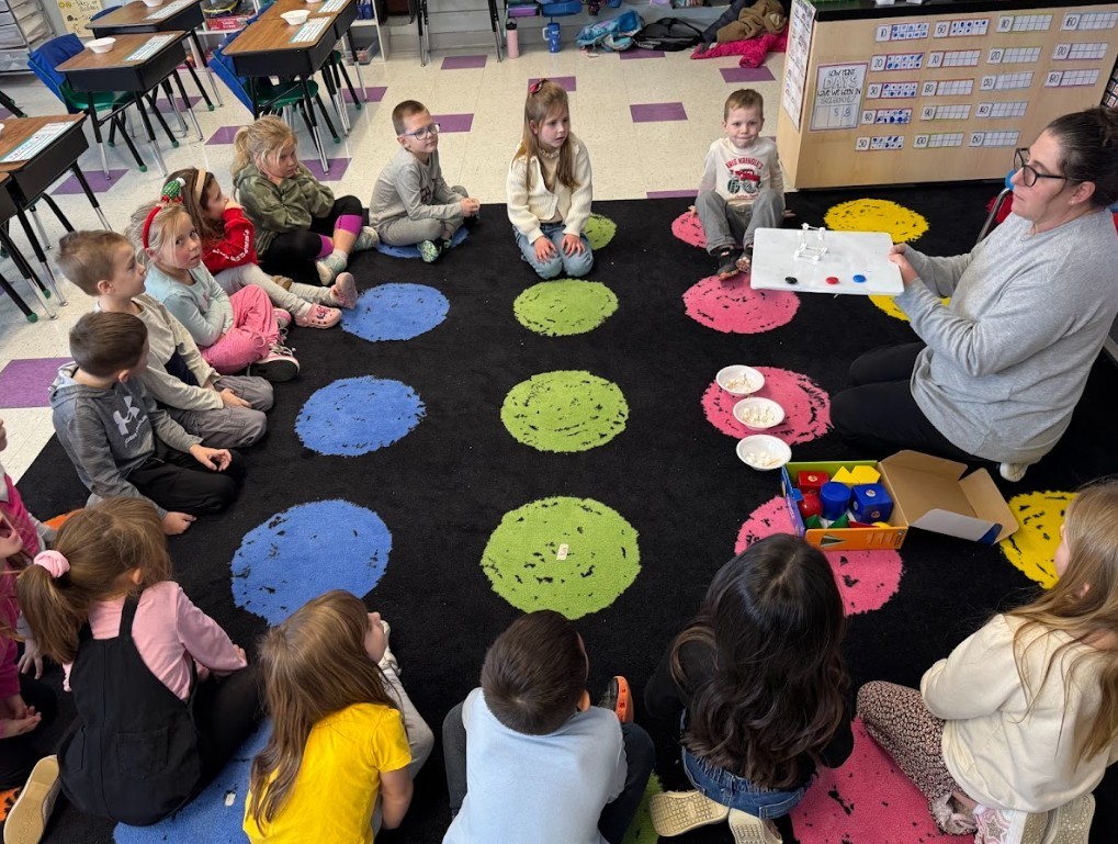 students with teacher in class