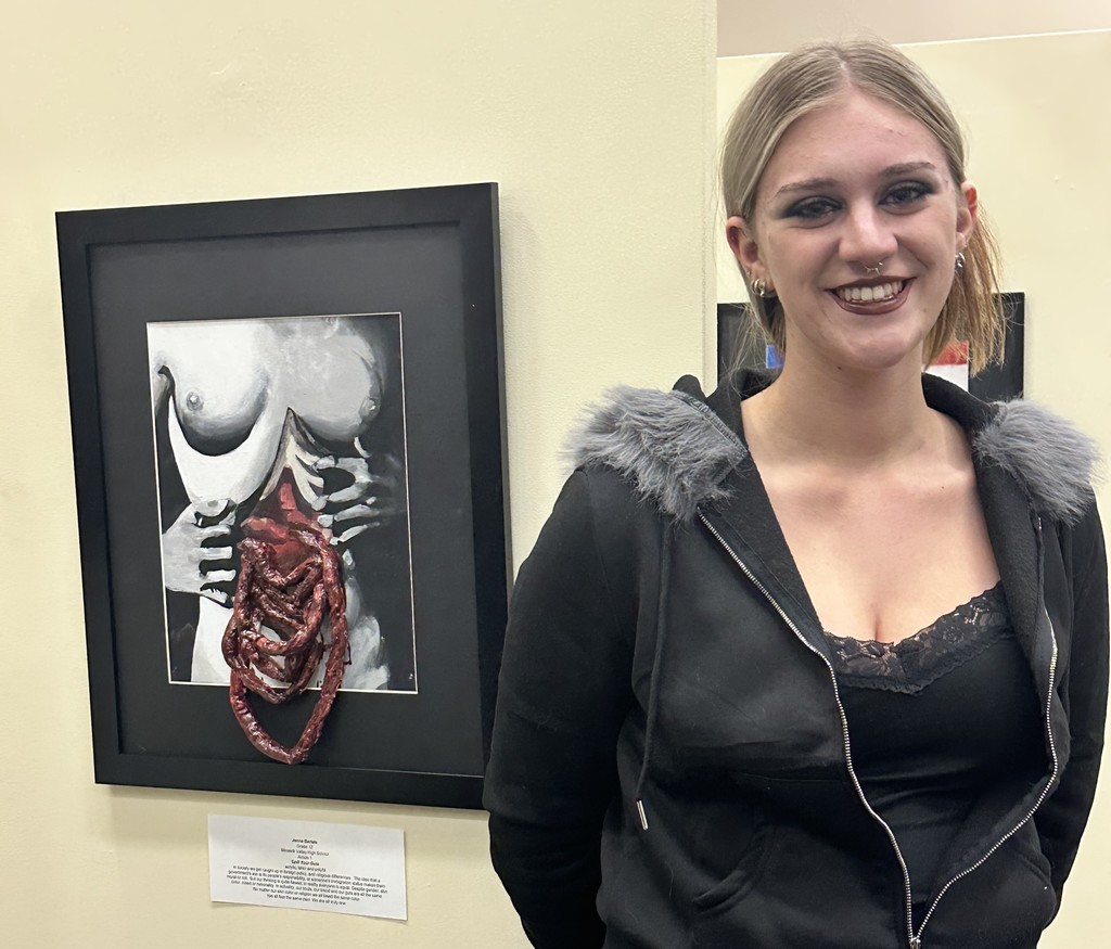 student at art exhibit