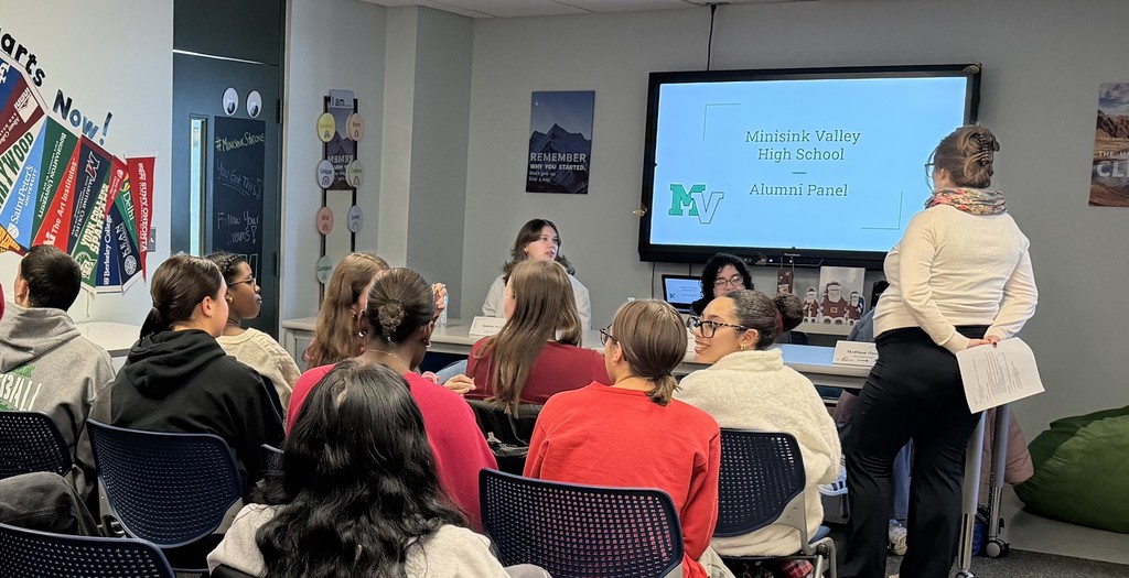 alumni speaking to students