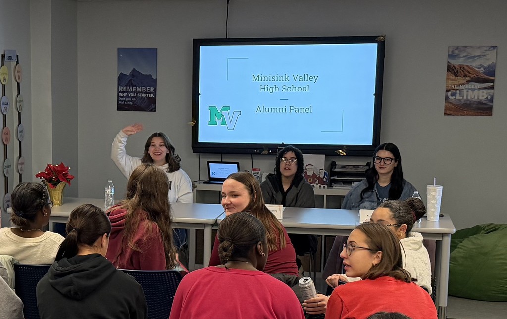 alumni speaking to students