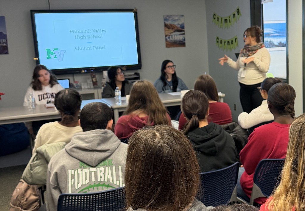 alumni speaking to students