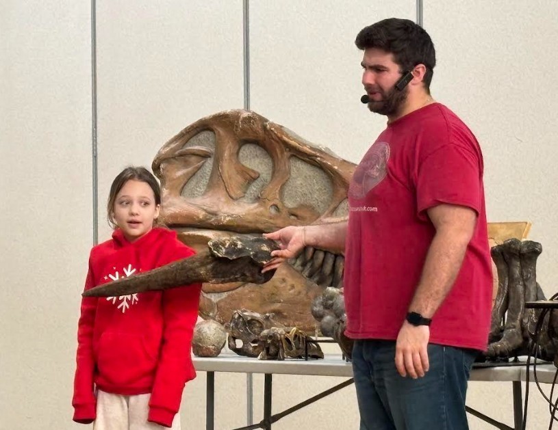 student with fossil