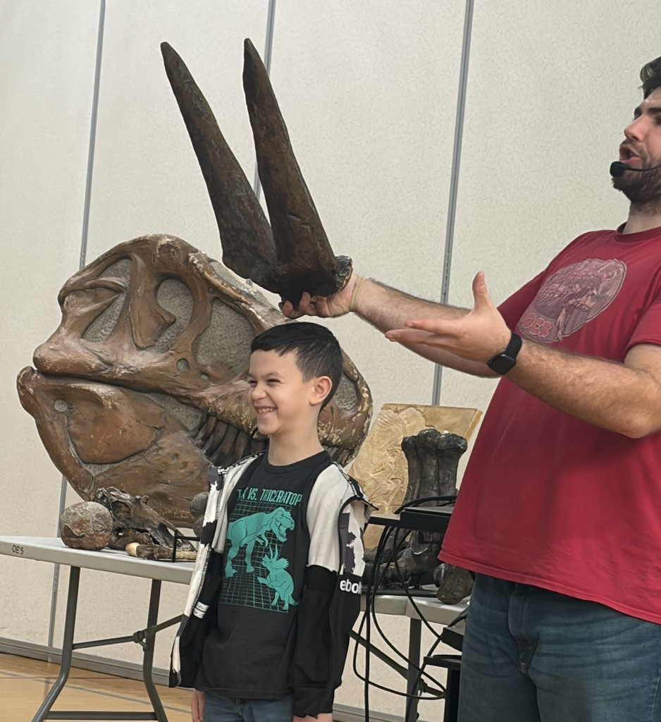 student with fossils