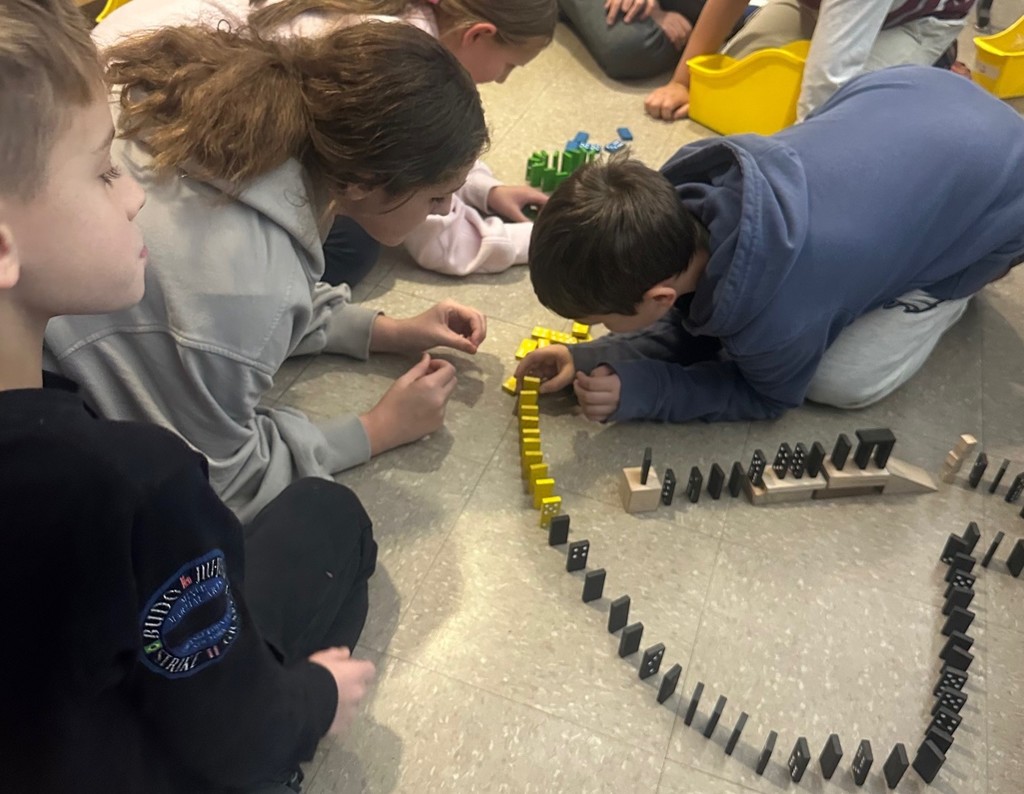 students and dominoes