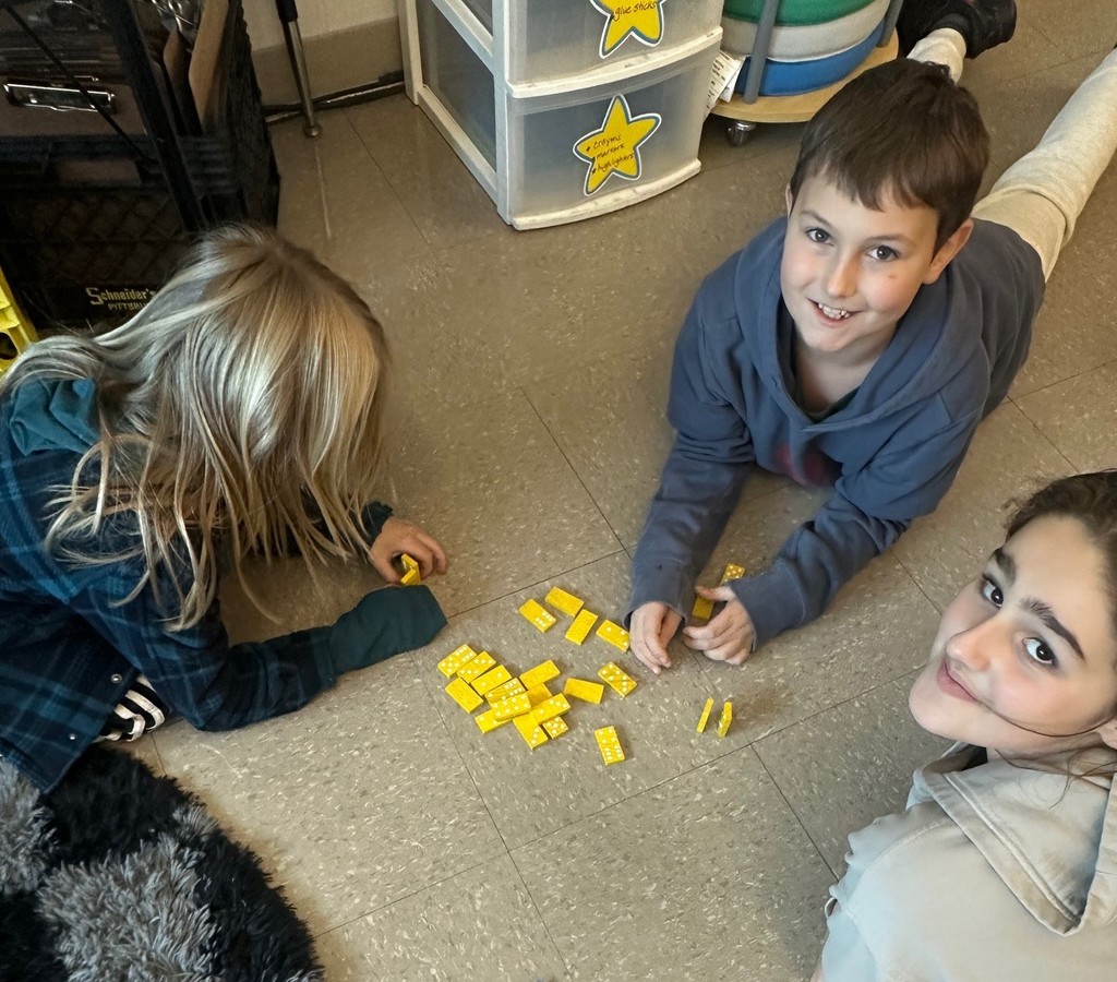 students and dominoes