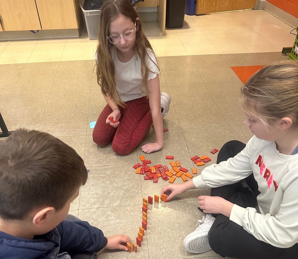 students and dominoes