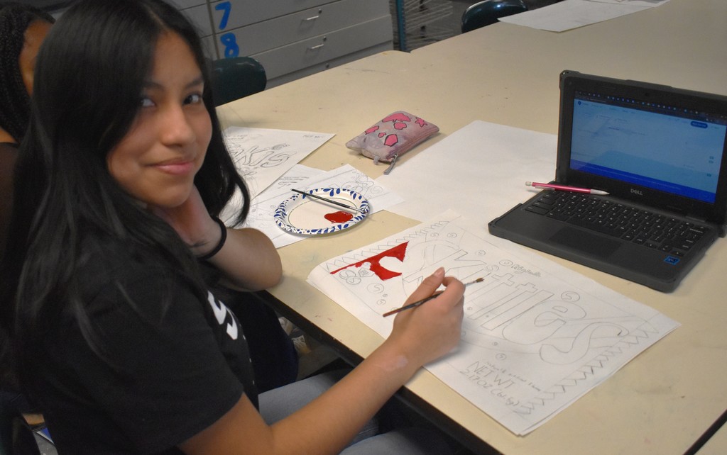 student in art class