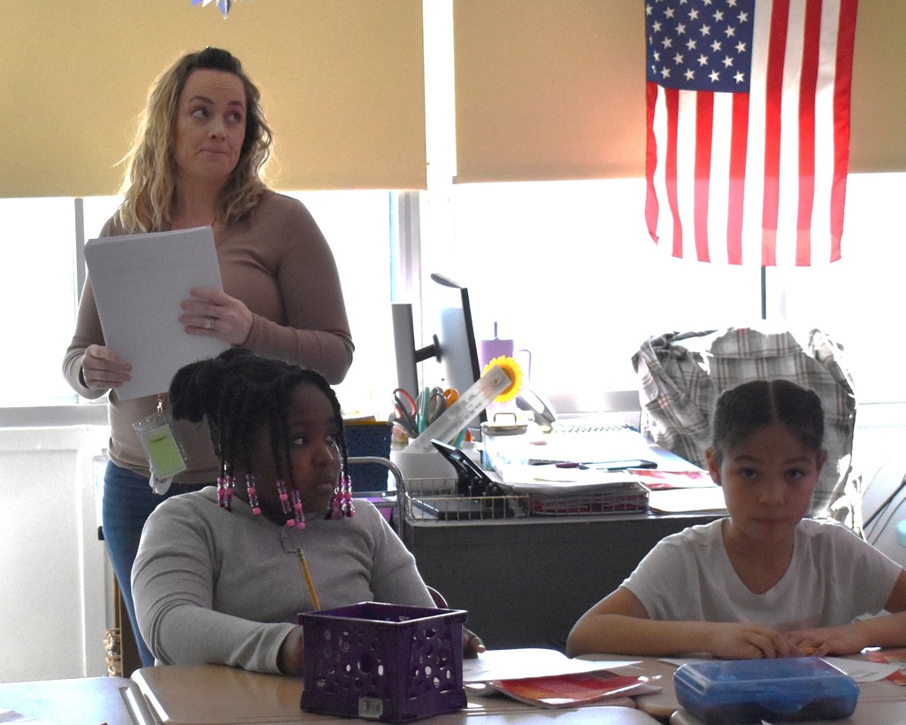 student and teacher in class