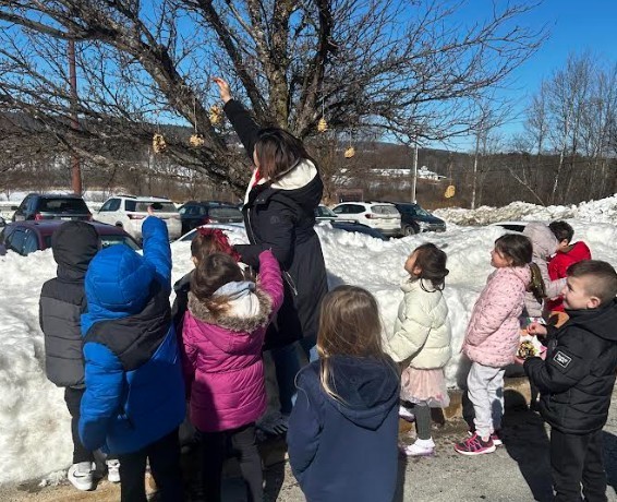 students with birdfeeders