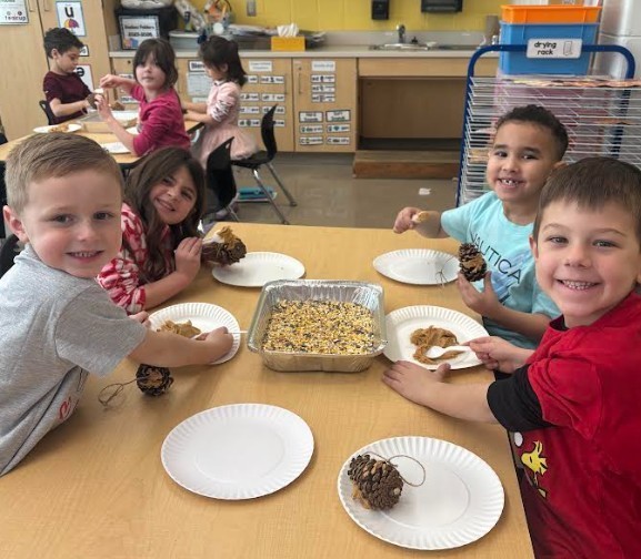 students with birdfeeders